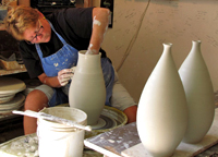 Cheryl Constantini of Nichibei Potters throws on the wheel