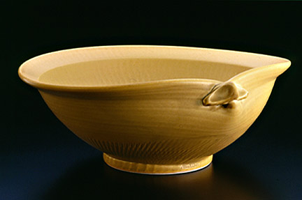 Shell bowl, yellow glaze